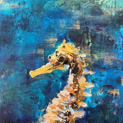 Abstract painting of a seahorse with blue and gold tones