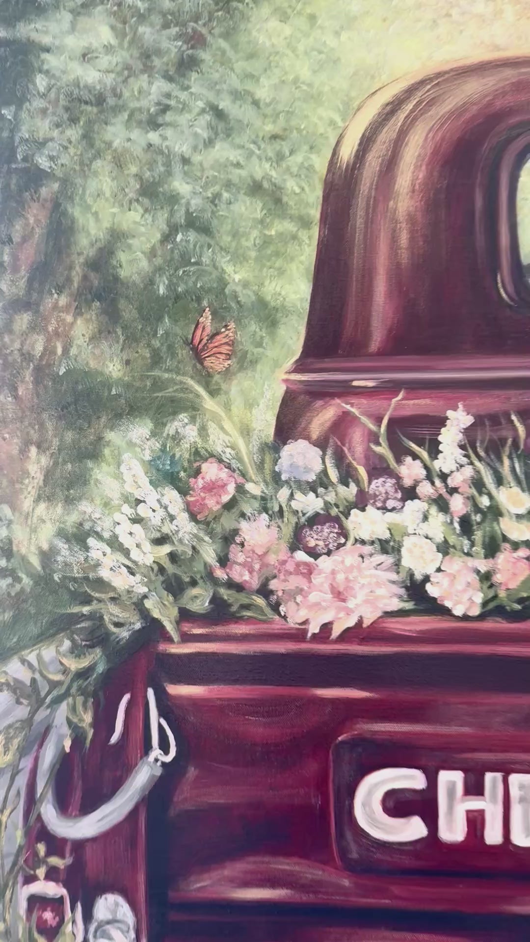 Video pan and zoom in to out of Old Vintage Red Chevrolet truck oil painting with a variety of flowers in the bed of truck foreground,  lots of Reds, pinks, greens and golds
