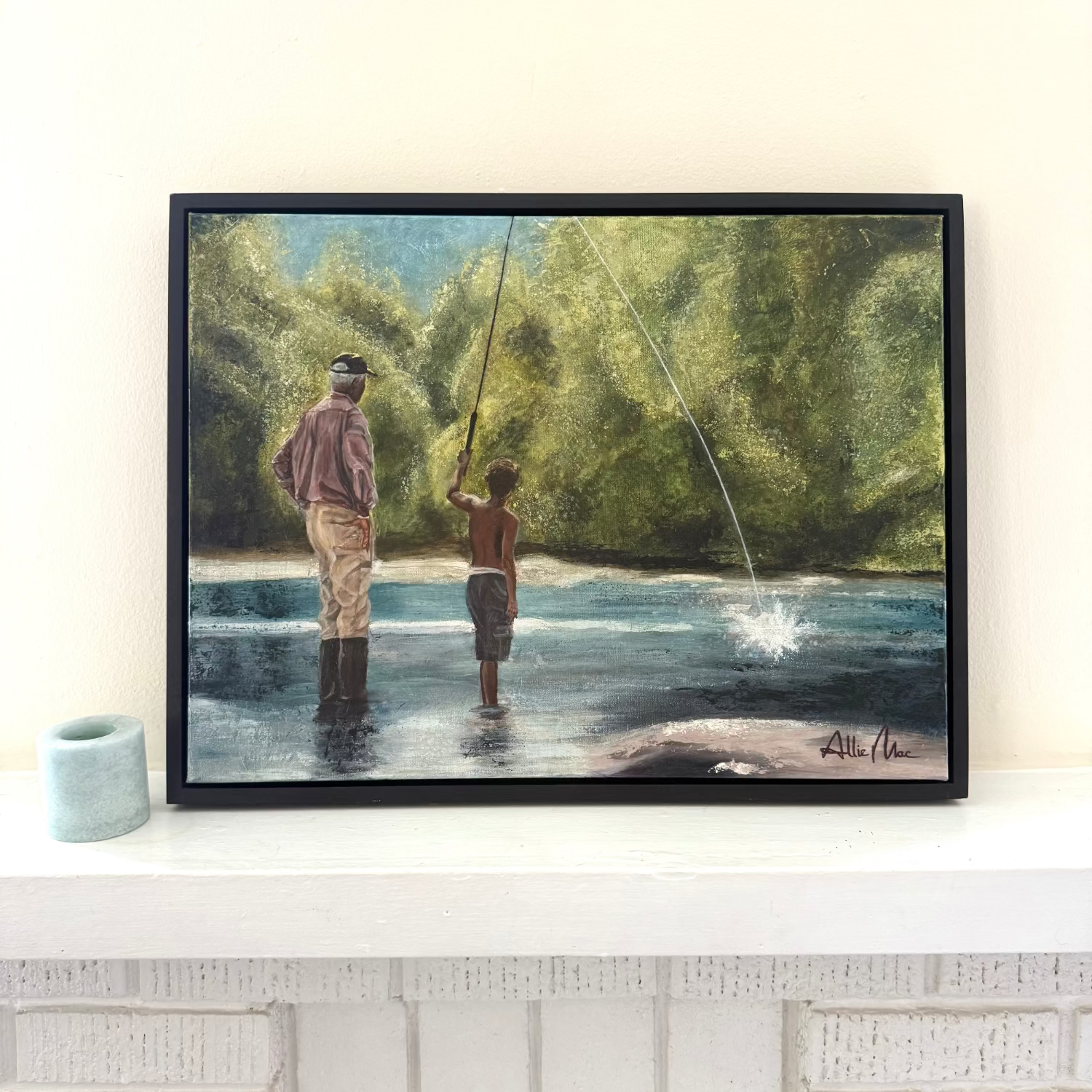 Teach a Man to Fish” by Allison Victoria — an impressionistic mixed media and oil painting of a grandfather teaching his grandson to fish in a peaceful river surrounded by glowing green trees and soft sunlight. The painting captures mentorship, discipleship, generational wisdom, faith, and the beauty of quiet childhood memories.